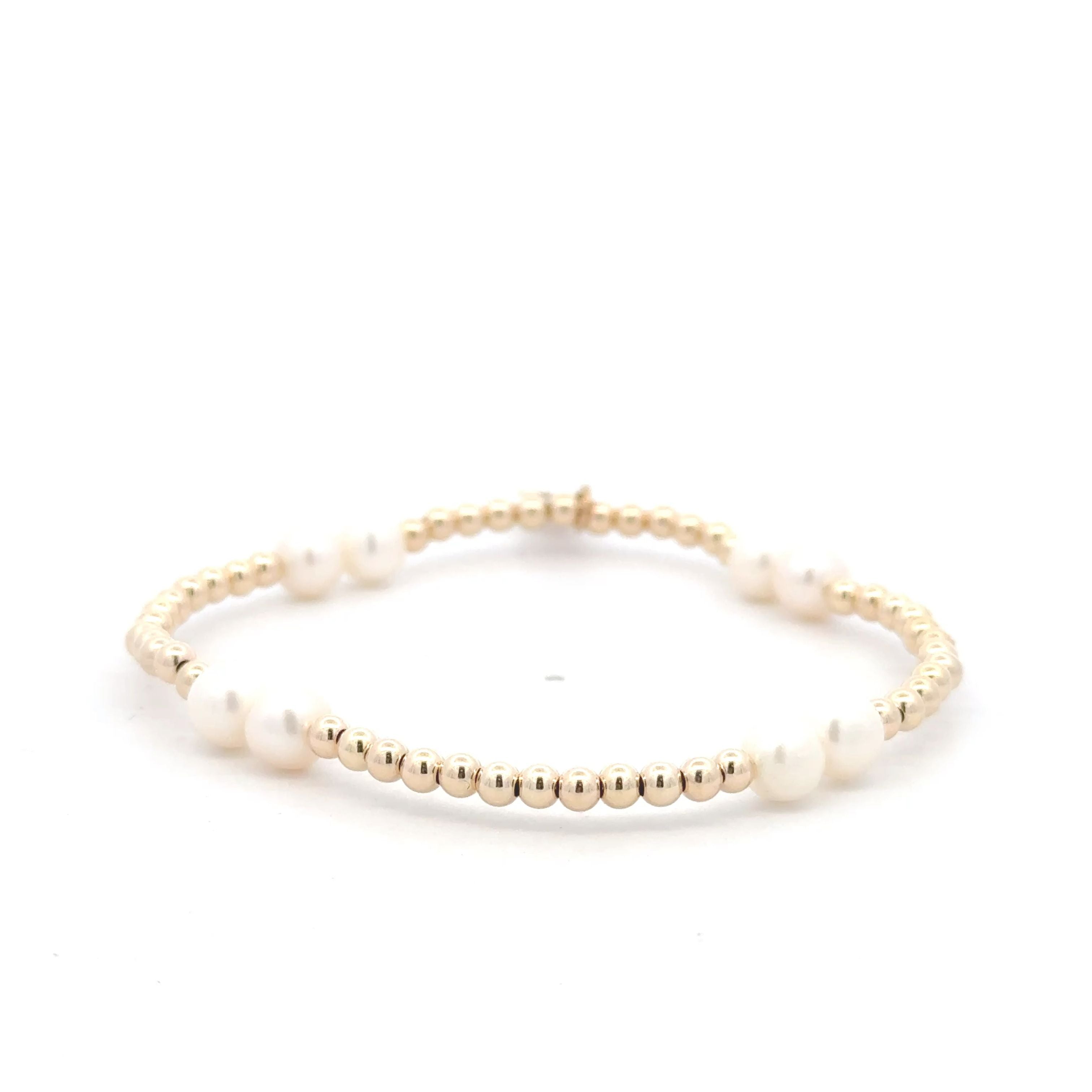 Four pearl gold coloured