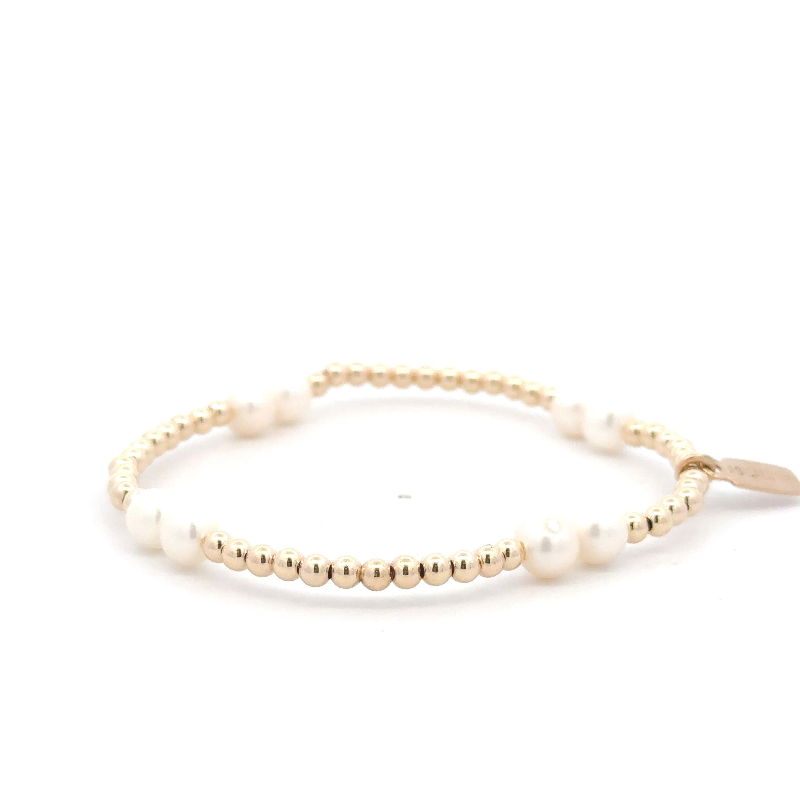 Four pearl gold coloured